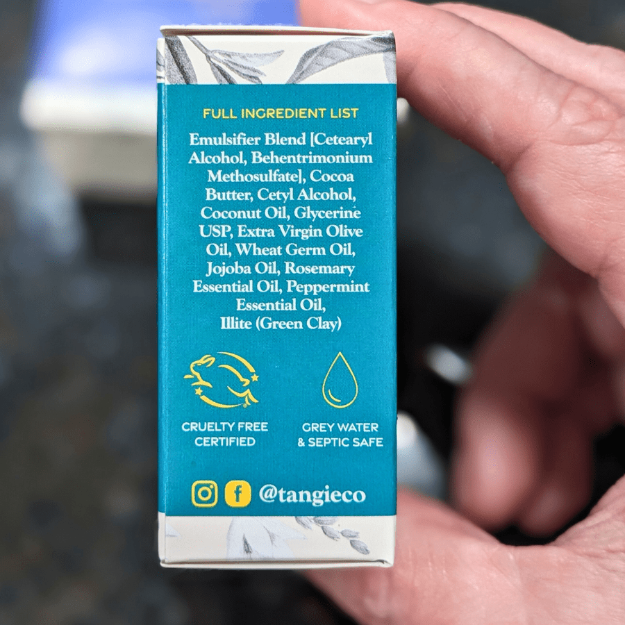 Tangie Beard Conditioner Bar, close-up of the ingredients list on the side of the Rosemary Mint-scented packaging, highlighting natural, plant-based ingredients.