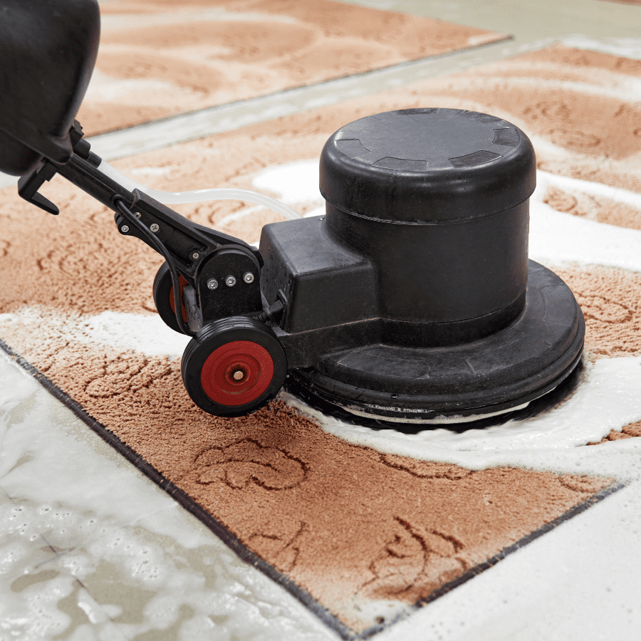 Carpet cleaning machine gliding over rug using Tangie Floor Cleaner Concentrate
