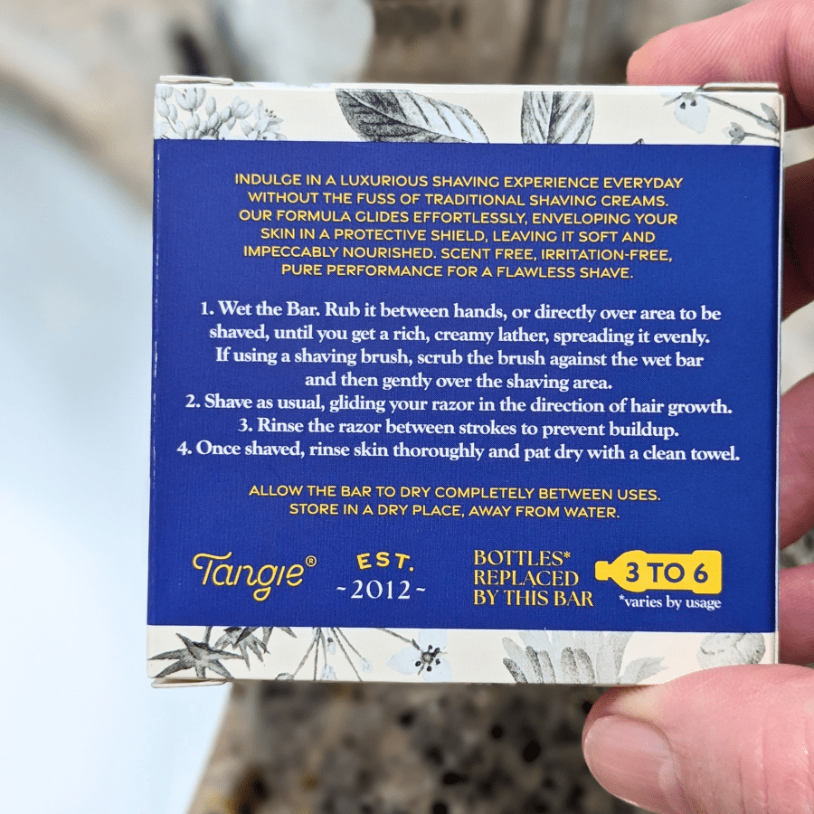 Back of Tangie Shave Bar packaging, displaying product details, usage instructions, ingredients, and certifications for the eco-friendly, plastic-free shave bar.