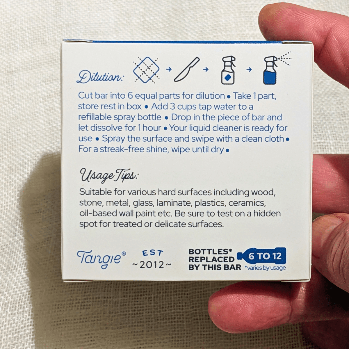 Back view of Tangie’s all-purpose cleaner concentrate packaging with dilution and usage instructions.