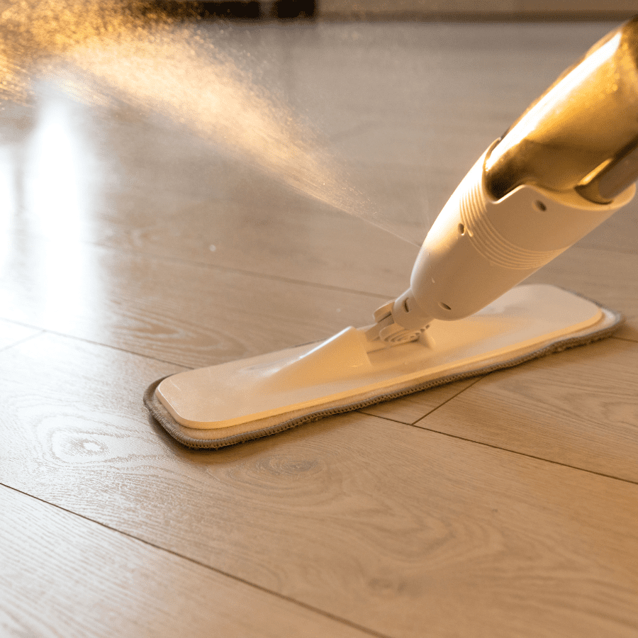 Spray mop cleaning hardwood floor using dissolved Tangie Floor Cleaner Concentrate