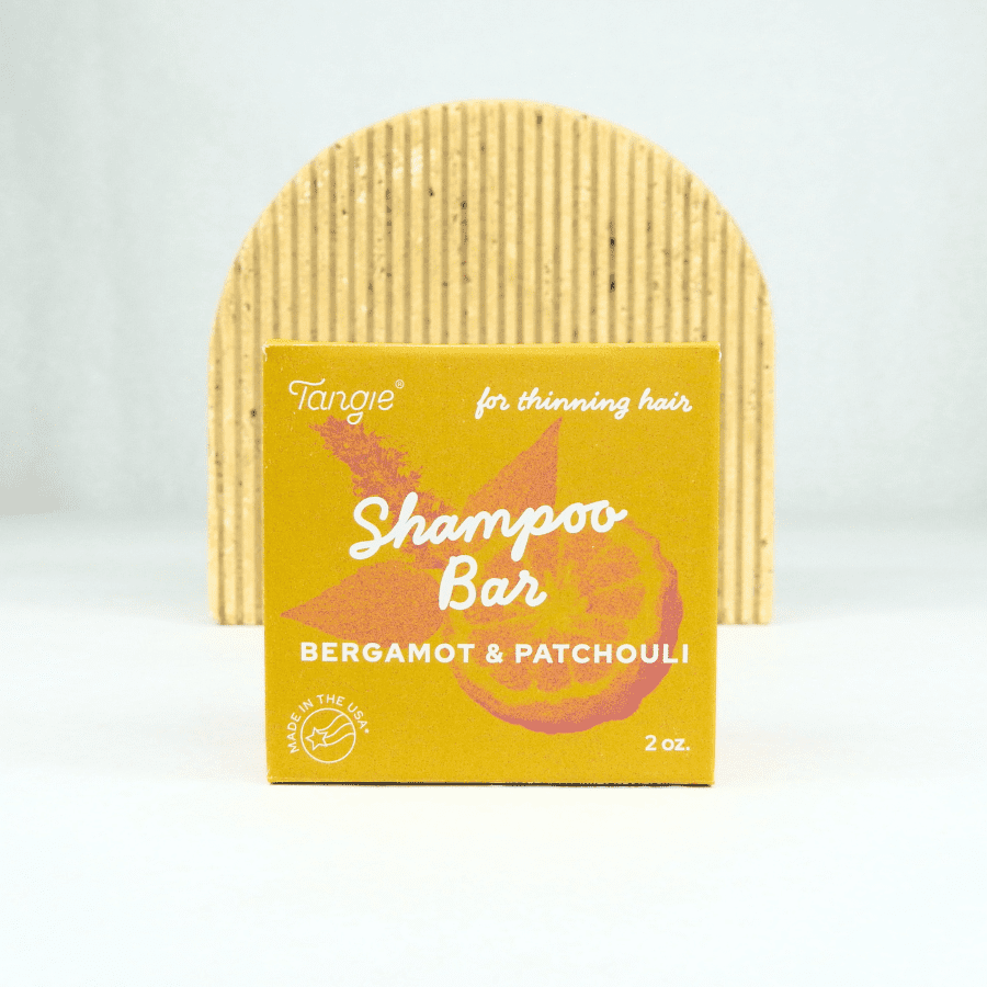 Tangie Bergamot & Patchouli shampoo bar in eco-friendly paper box packaging – natural, plastic-free solid shampoo.