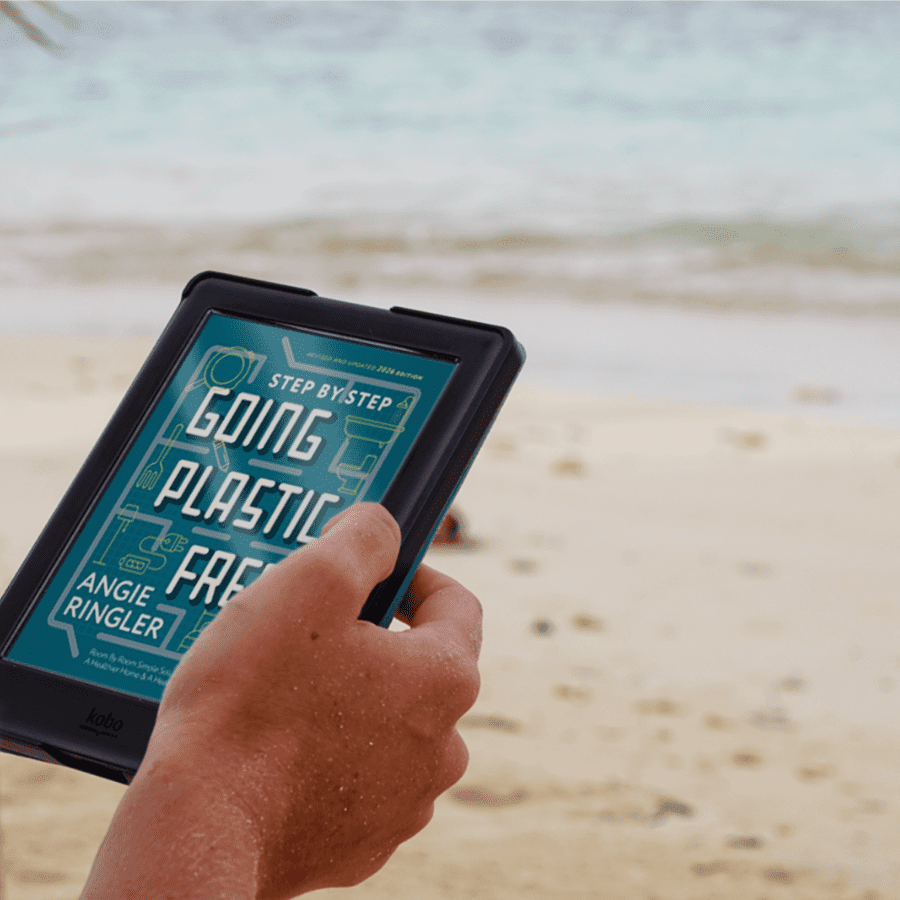 Going Plastic Free: Room by Room eBook (2026 edition) on an e-reader at the beach.