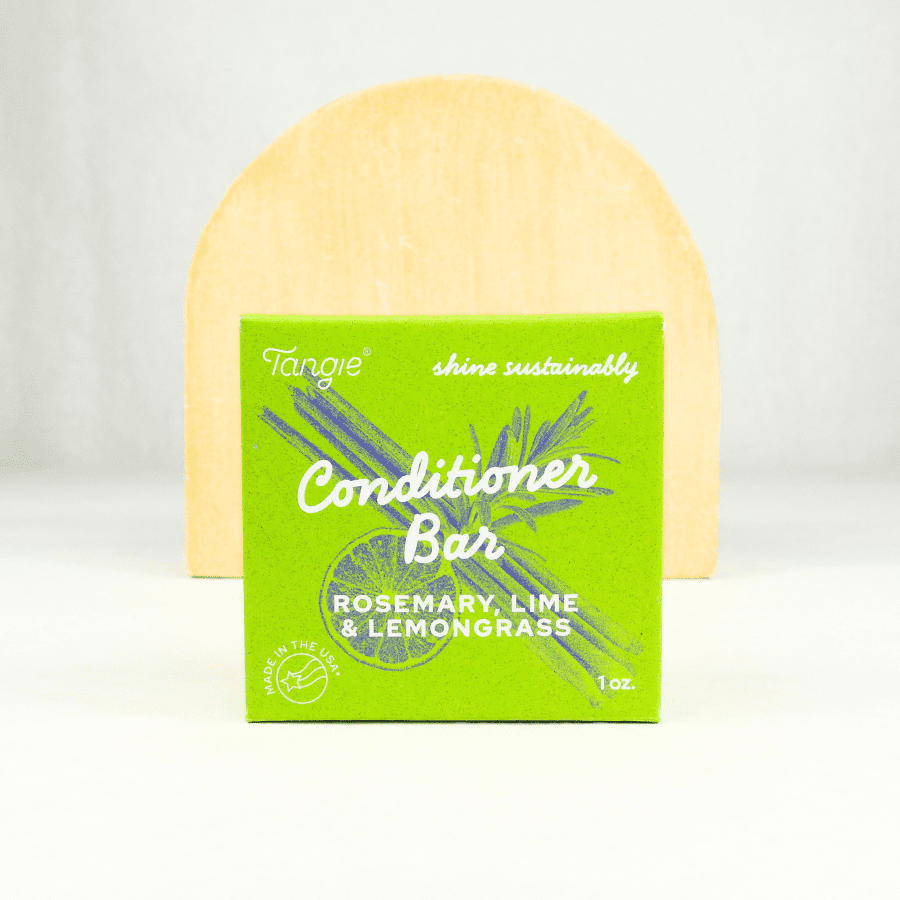 Plastic-free conditioner bar with rosemary, lime, and lemongrass essential oils in green Tangie packaging. Ideal for natural haircare and eco-conscious consumers.